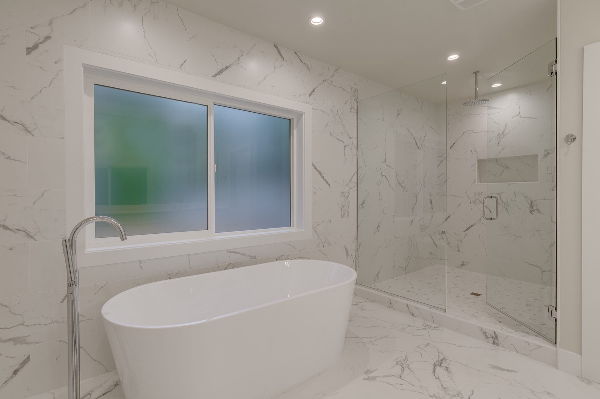 Rebuilt bathroom following a water-damage restoration project.
